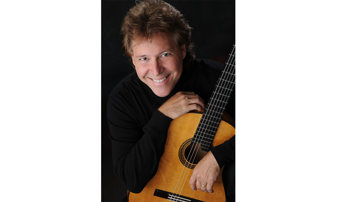 Photo of Stephen Robinson with guitar