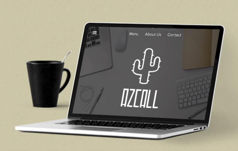 Image of a laptop next to a coffee mug
