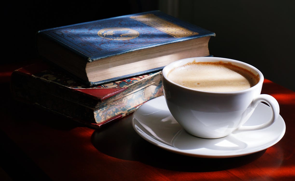 Image of coffee and books / Photo by Suzy Hazelwood on Pexels