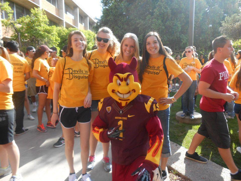 students and Sparky posing during Devils in Disguise event