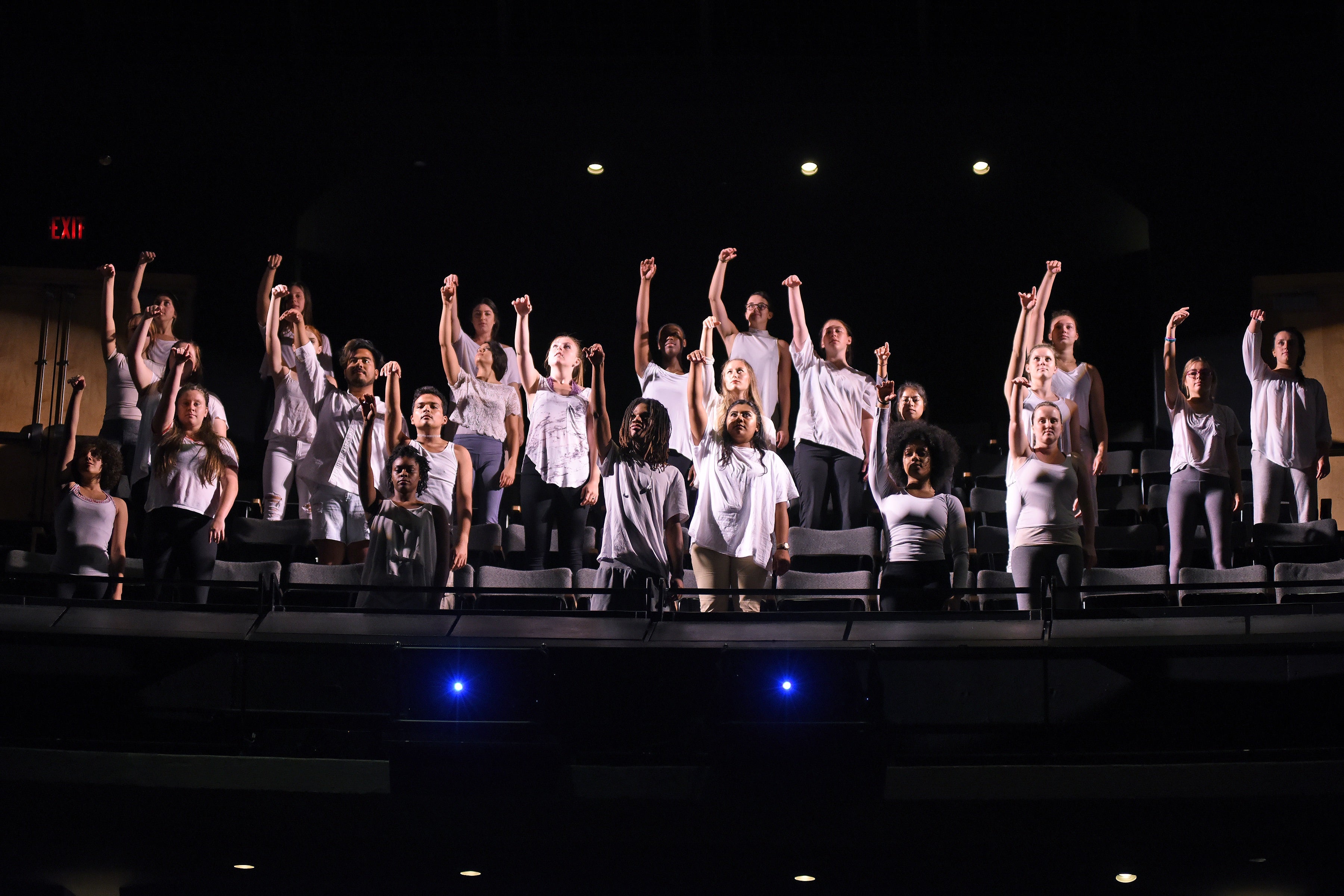 Dancers perform on stage