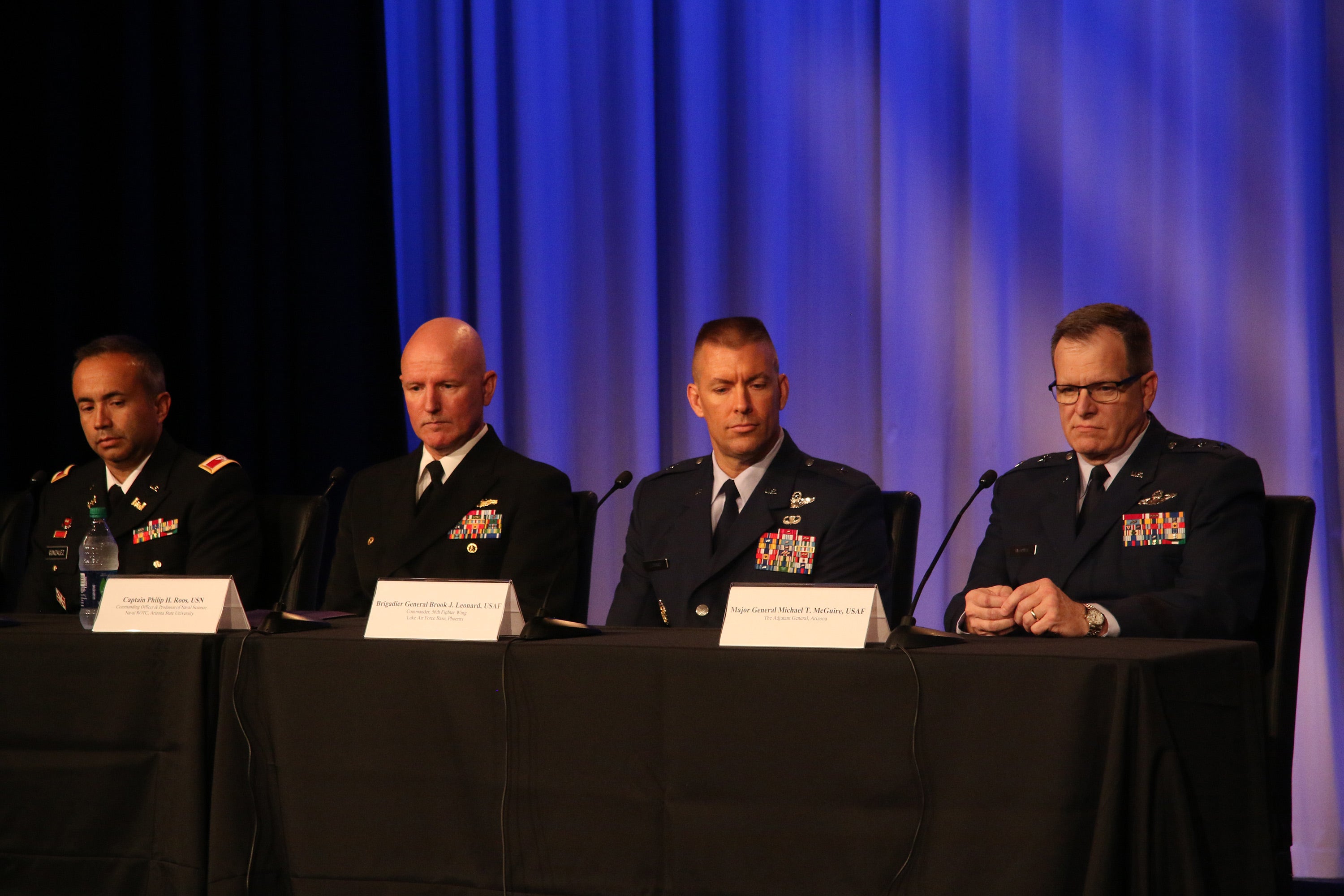 military members sitting at table