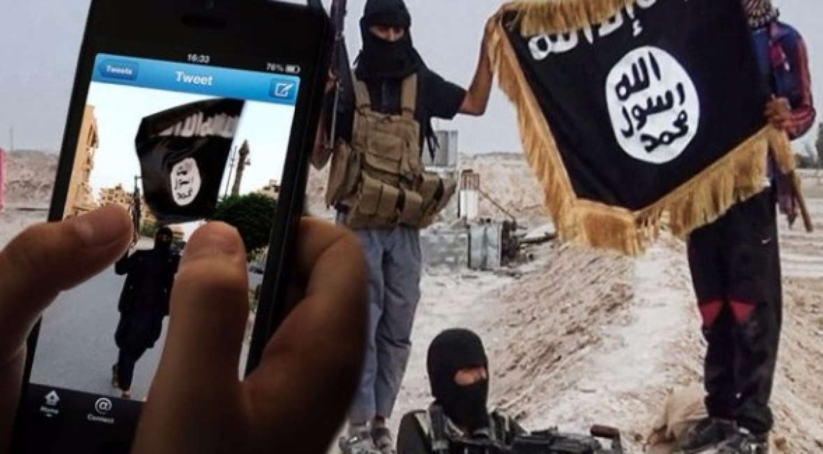 A photograph of members of the Islamic State using social media