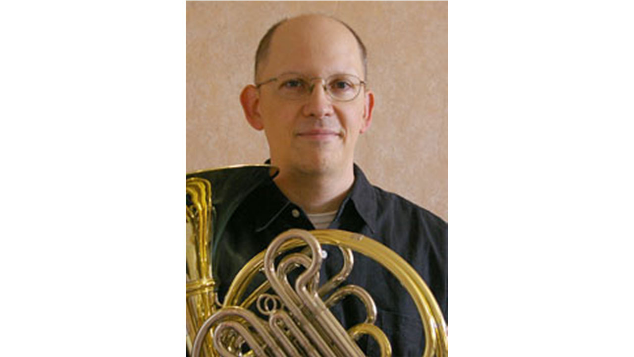 Photo of John Ericson with his French horn