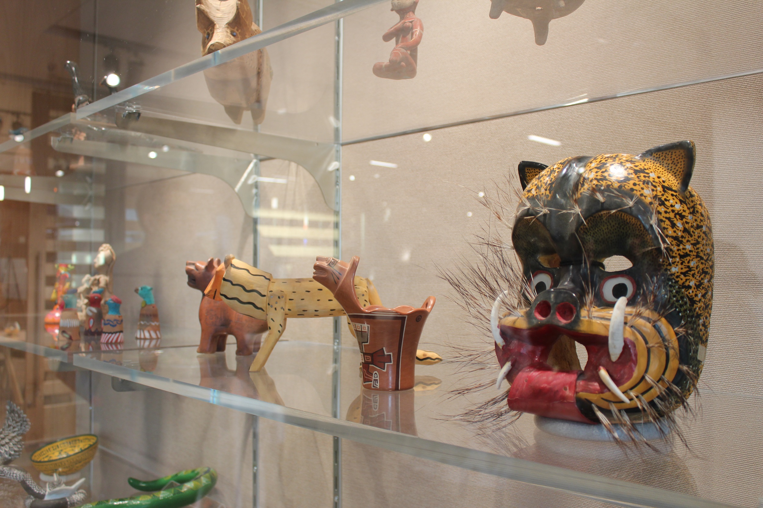 Photo of exhibit display with jaguar mask
