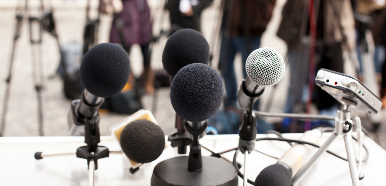Microphones on a table for a discussion panel