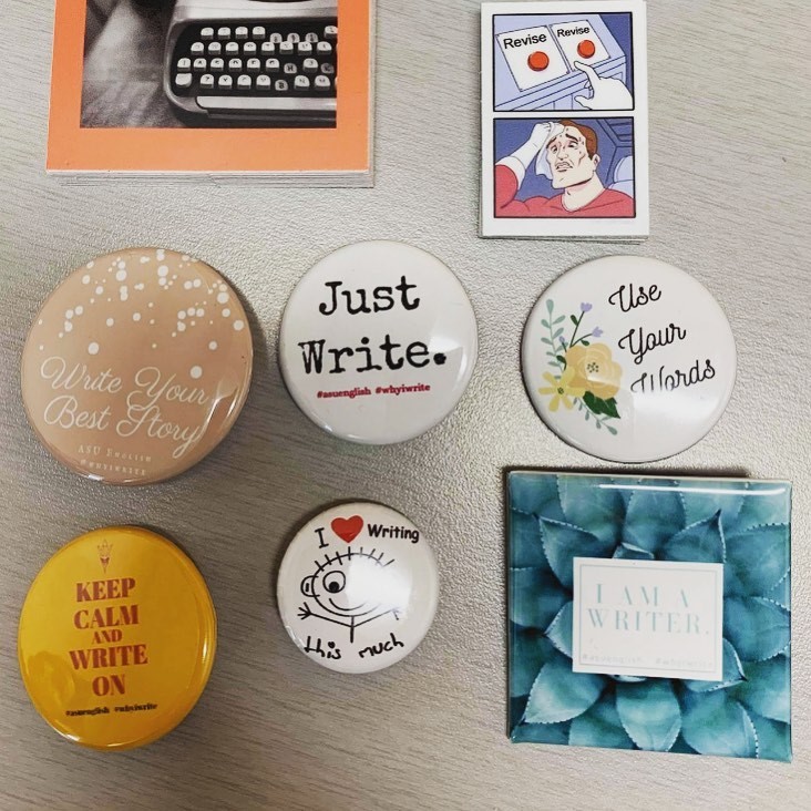 Image of pins and buttons w/ a writing theme / Photo by Eric Brown