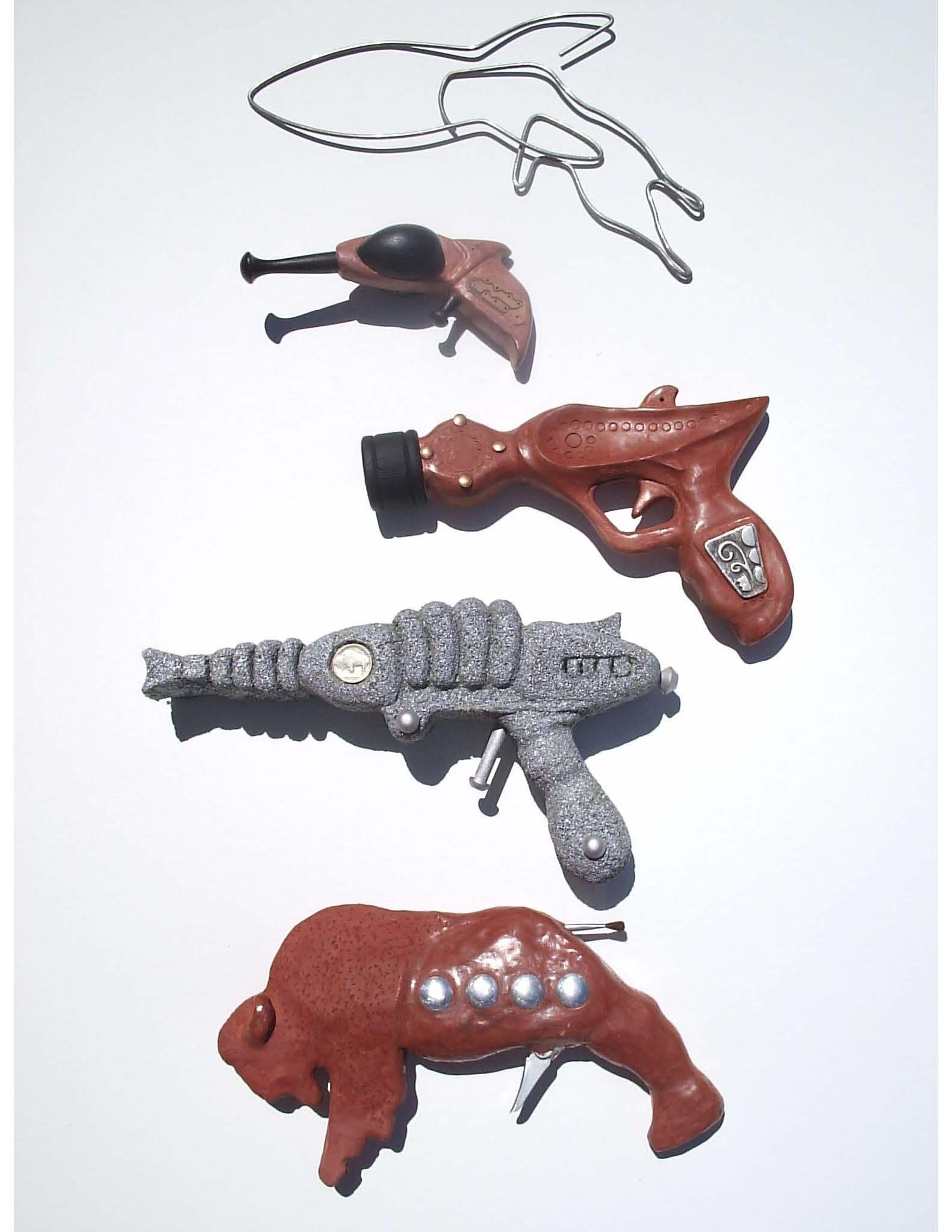 sculptures of guns produced from a variety of recycled materials