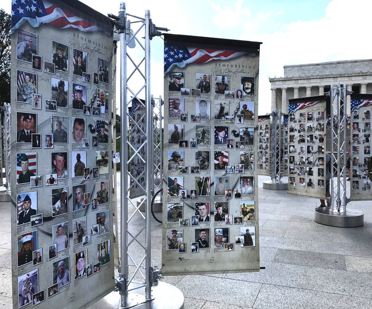outdoor exhibit of photographs of fallen U.S. military soldiers