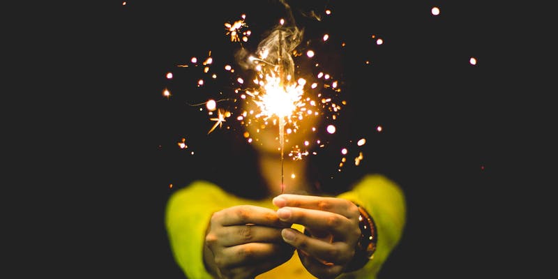 Image of person holding a sparkler