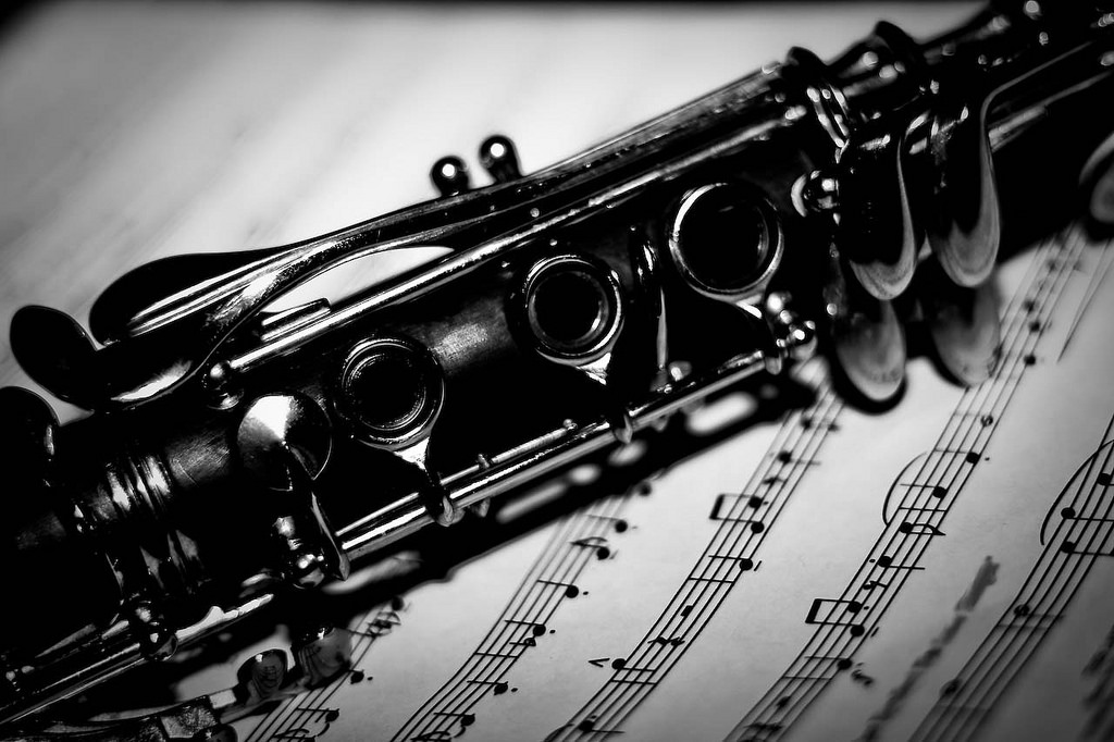 Photo of a clarinet over sheet music