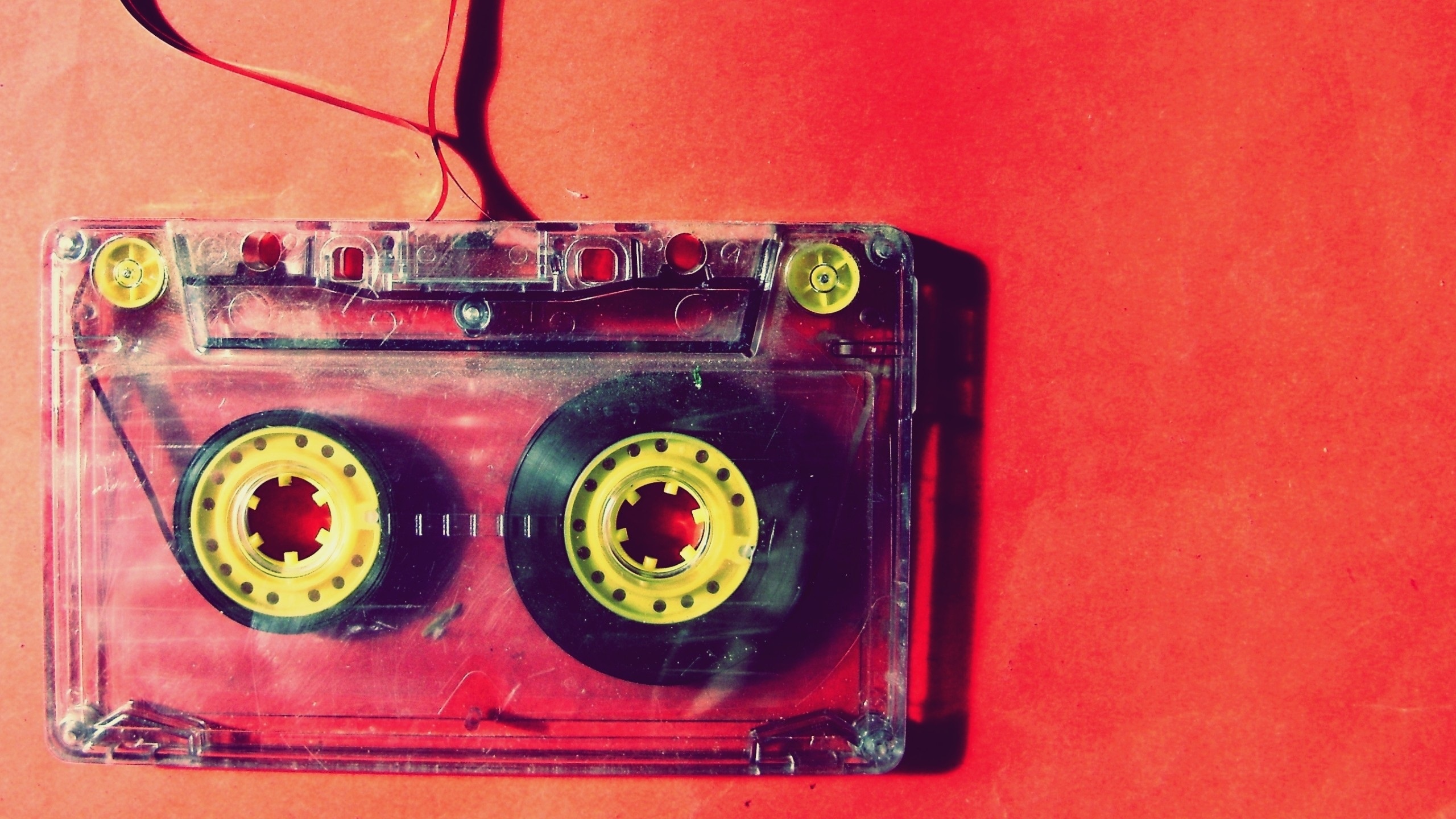 Image of a vintage cassette tape in reds and yellows courtesy of pxhere