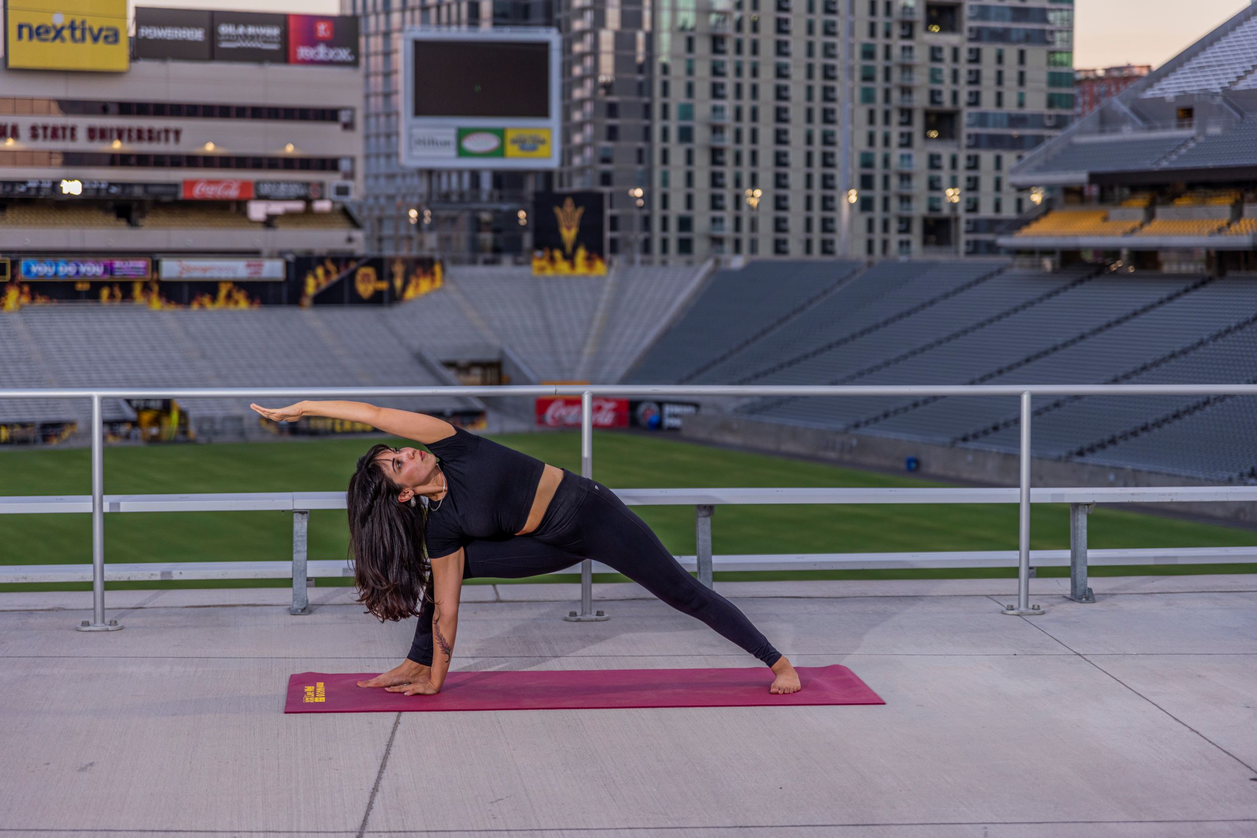 Yoga instructor Biannca Dominguez poses on a yoga mat